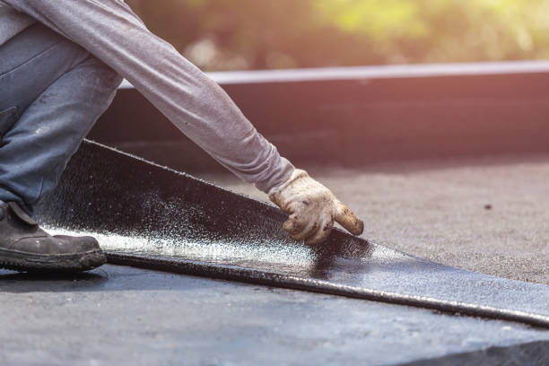 Professional Basement Waterproofing technician working in Kings Park, NY